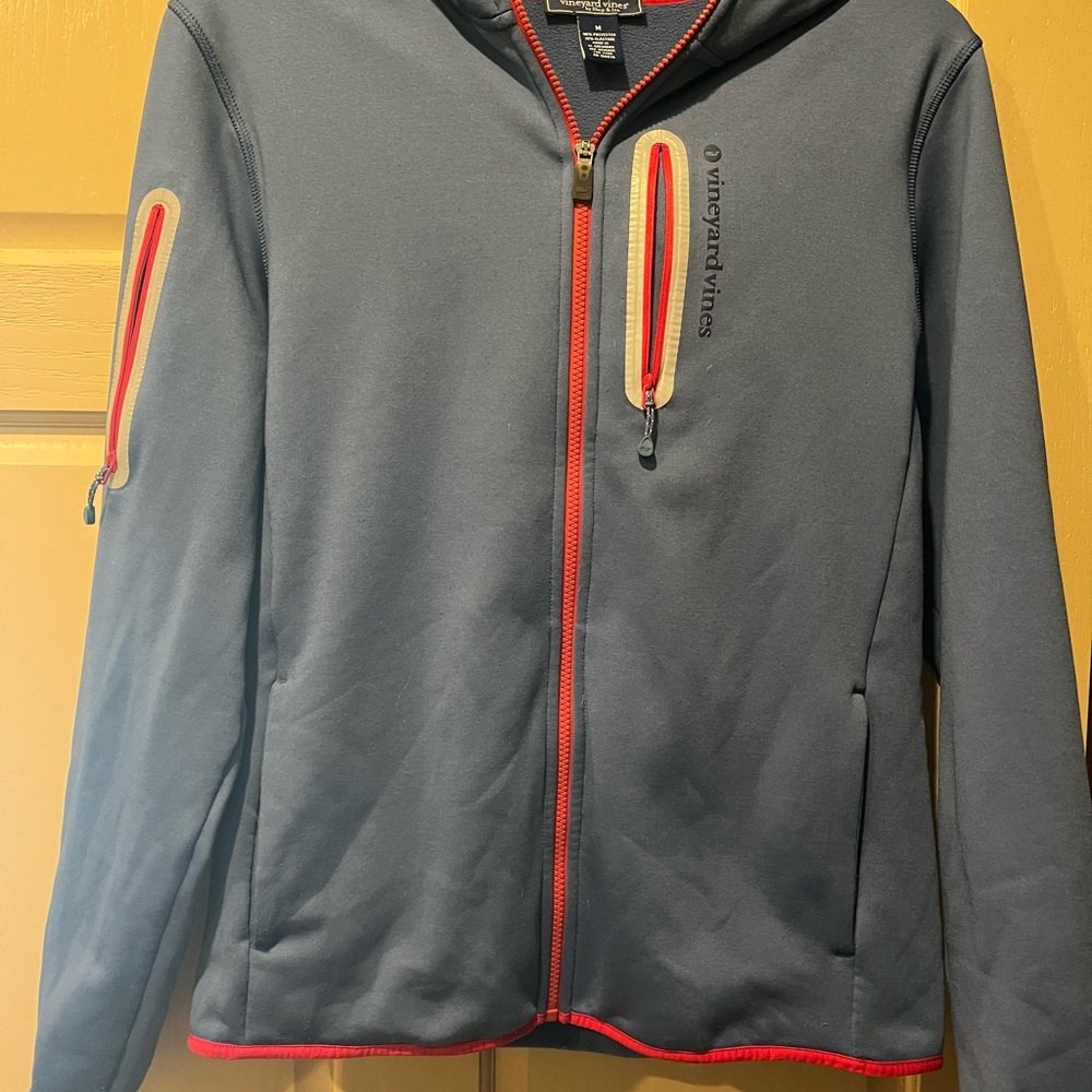 Vineyard Vines Full zip hooded jacket. Size Men’s M. Blue with red trim.